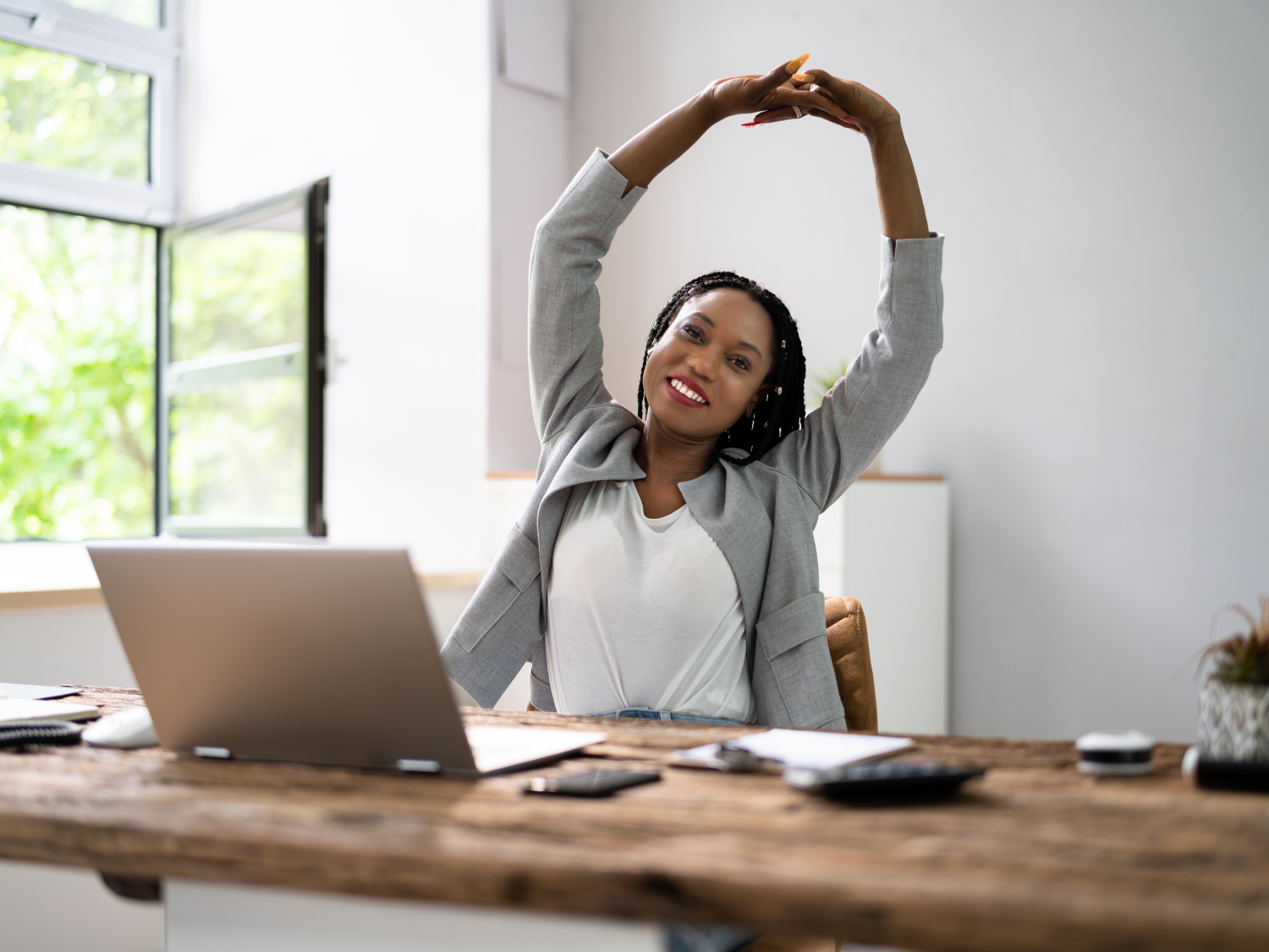 Woman stretching at work