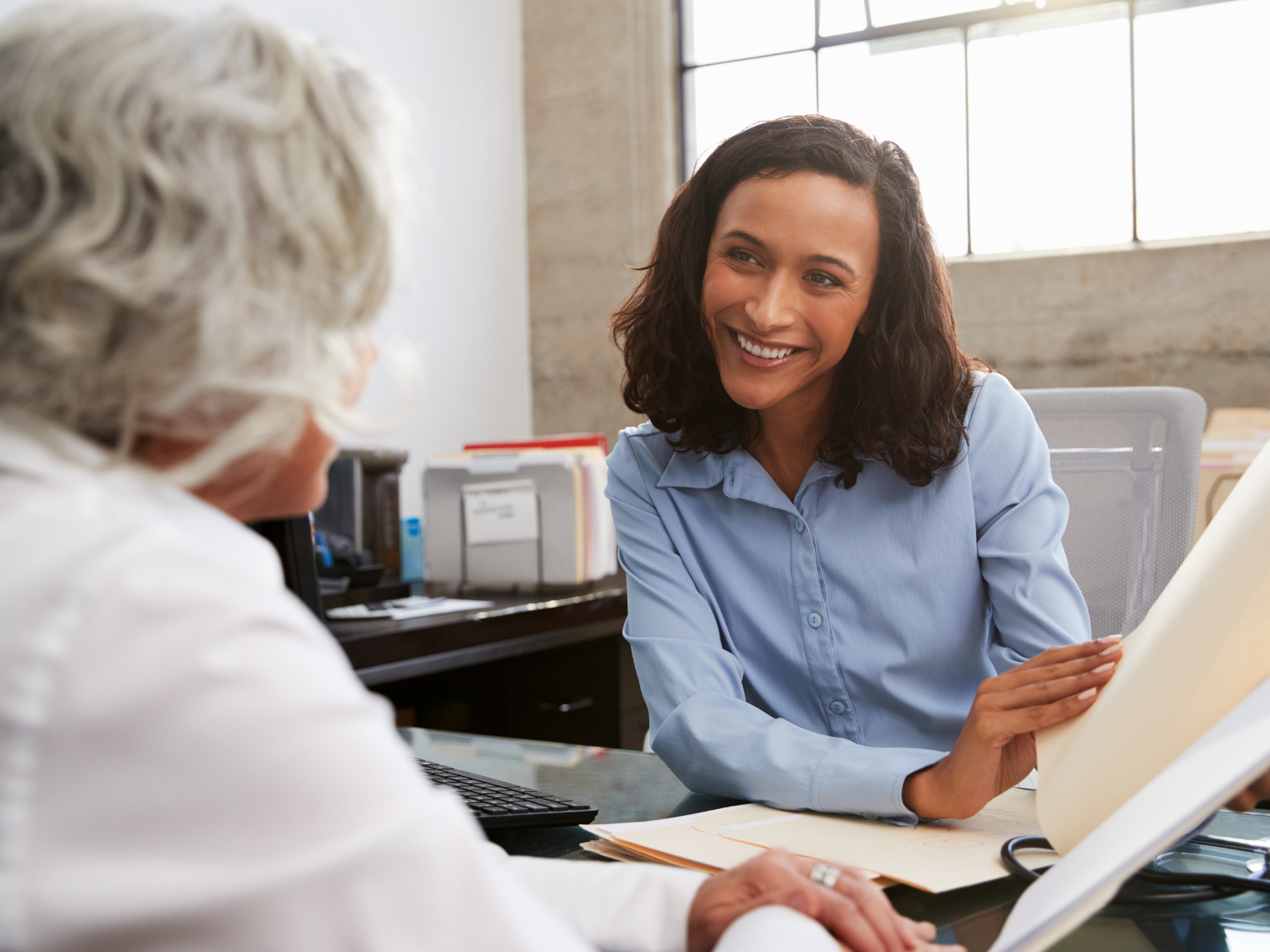 Women shows paperwork to member