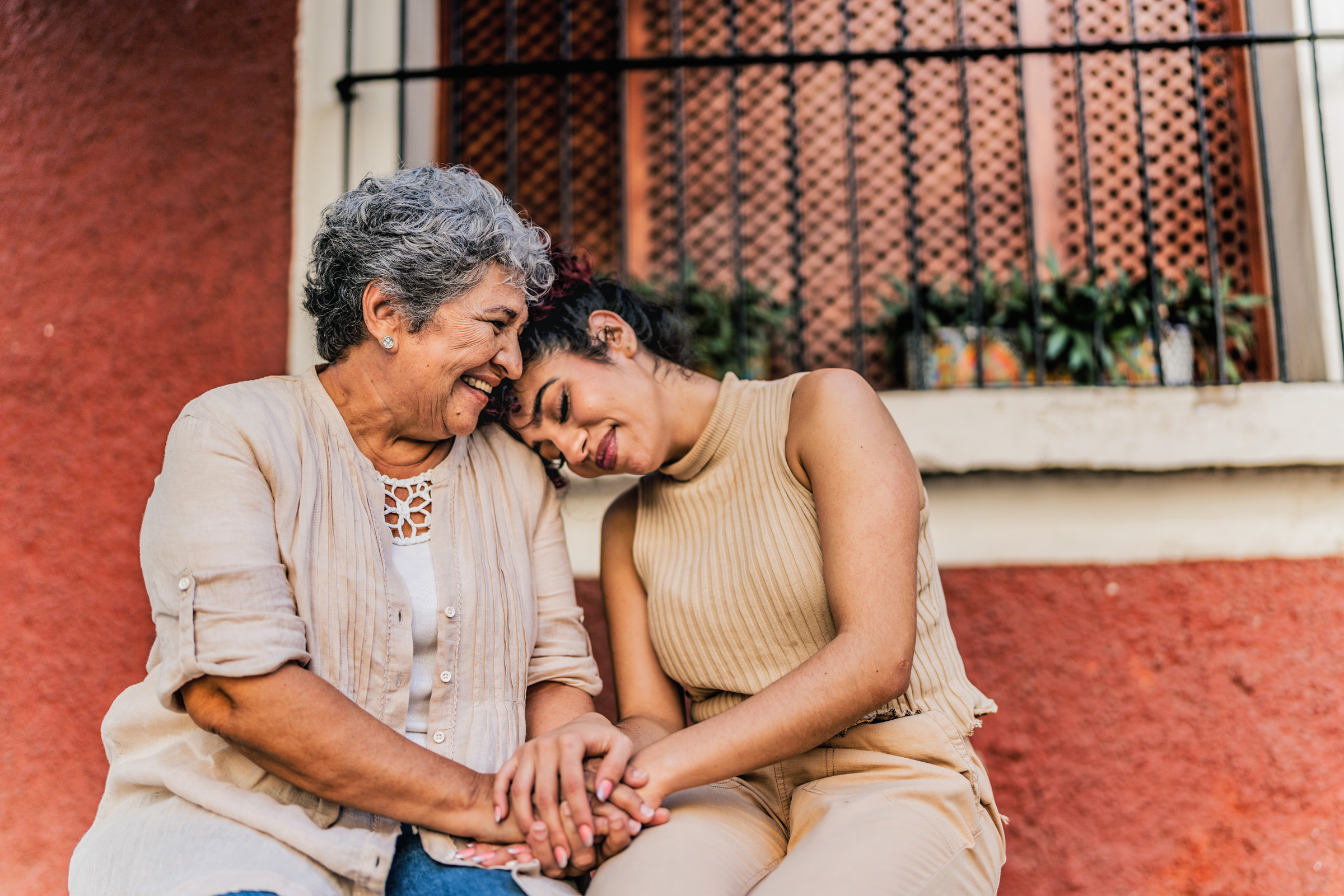 Grandma and granddaughter cuddle
